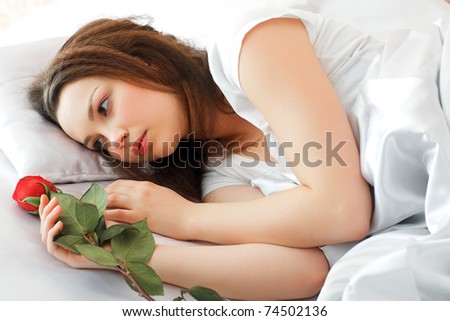 young beauty girl lying in the bed
