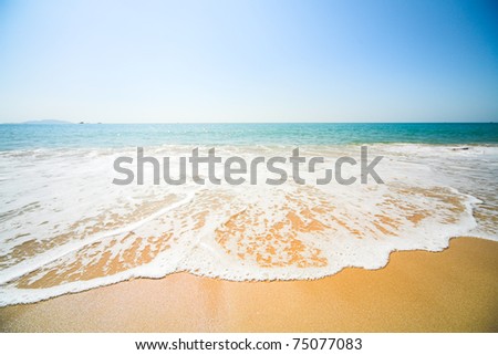 sunny beach, blue ocean and clean sky