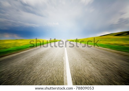 High speed road with cloudy sky background