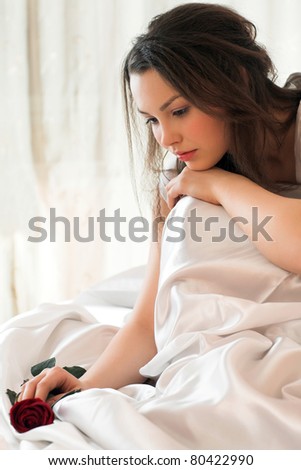 young beauty girl lying in the bed