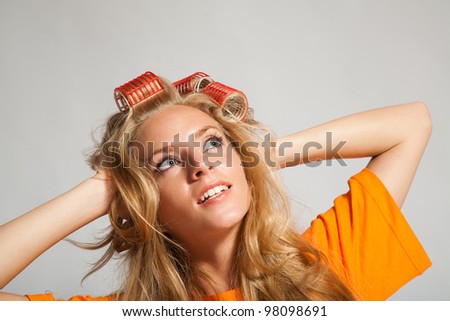 young beauty woman with hair-rollers