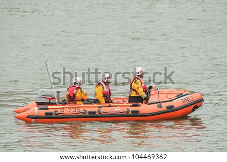 LONDON, UK - JUNE 3:  RNLI lifeboat crew on duty at the Queen Elizabeth II Diamond Jubilee Pageant on the River Thames in London, UK on June 3, 2012