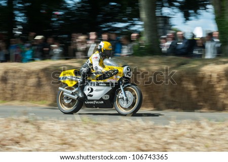 GOODWOOD, UK - JULY 1: Three-time 500cc motorcycle world champion Kenny Roberts on his classic Yamaha YZR500 riding the hill course at Goodwood, UK on July 1, 2012