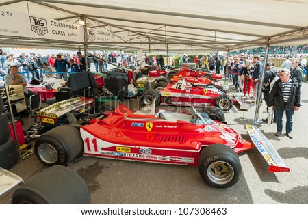 GOODWOOD, UK - JULY 1: Collection of classic Ferrari F1 racing cars in the service pits at the Festival of Speed motor-sport event held at Goodwood, UK on July 1, 2012