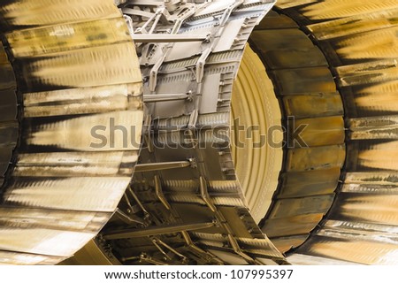 abstract of scorched engine thrust outlets on a military jet