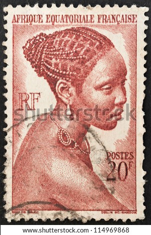 FRENCH EQUATORIAL AFRICA - CIRCA 1947: Mail stamp printed in former French Equatorial region of Africa featuring a beautiful black woman with woven hair, circa 1947