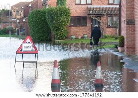 WINDSOR, UK - 11 FEBRUARY: One of many flooded streets after the River Thames burst its banks near Windsor, UK on 11 February, 2014