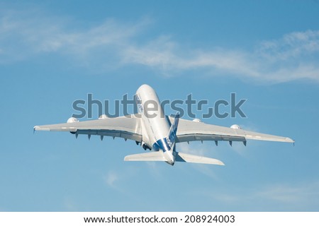 FARNBOROUGH, UK - JULY 18: Graceful take-off for a giant Airbus A380 double-decker jet airliner from Farnborough Airport, UK on July 18, 2014