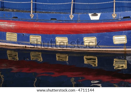 colorful old boat detail on water