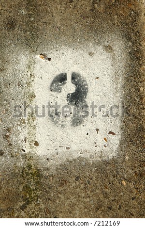stock photo graffiti number three painted on a concrete wall
