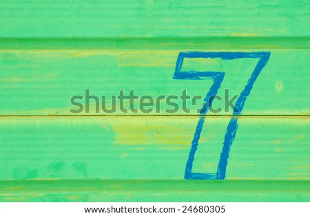 number 7 painted a battered metal door