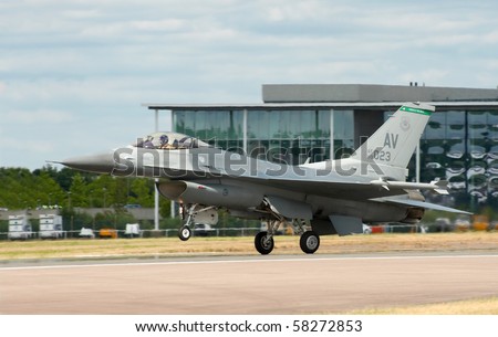 FARNBOROUGH, UK - JULY 24: USAF F-16 dropping the nose wheel on landing. July 24 2010, Farnborough Airshow, UK