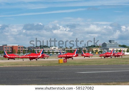 FARNBOROUGH, UK - JULY 25: Unusual angle of the Red Arrows aerobatic display jets taxiing at the same time prior to take-off at the Farnborough airshow. July 25 2010, Farnborough, Hampshire, UK