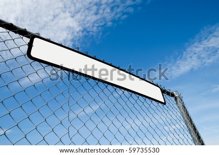 sign fixed to metal fencing with blank copy area