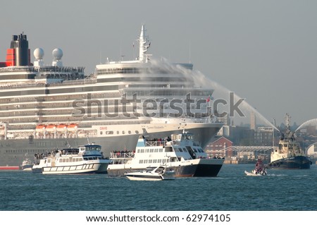 SOUTHAMPTON, UK - OCT 12: Hazy sunset departure from the Queen Elizabeth ocean cruise liner on her maiden voyage. Oct 12, 2010, Southampton, UK.