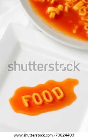 food spelt with pasta letters on a square plate