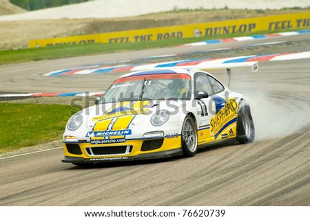 THRUXTON, UNITED KINGDOM - MAY 1: George Brewster blows a tire during a Porsche Carrera Cup race on May 1, 2011 in Thruxton, UK.
