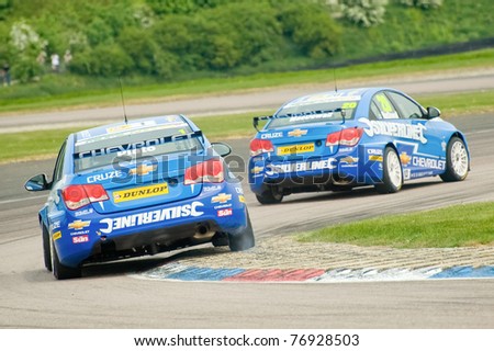 THRUXTON, UNITED KINGDOM - MAY 1: Silverline Chevrolet driver Alex MacDowell leading team-mate Jason Plato during the British Touring Car Championships on May 1, 2011 in Thruxton, UK.