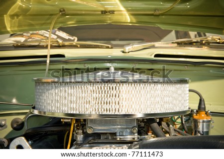 air filter in the engine bay of a retro styled hot-rod vehicle
