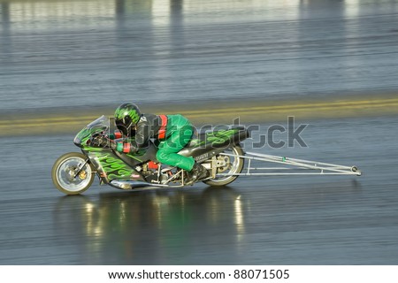 NORTHAMPTONSHIRE, UK - OCT 29: Powerful dragster motorcycle performs at the Flame and Thunder race event on Oct 29, 2011 at Santa Pod Raceway in Northamptonshire, UK
