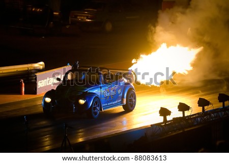 NORTHAMPTONSHIRE, UK - OCT 29: Jet powered Blue Max VW Beetle burnout at the Flame and Thunder event on Oct 29, 2011 at Santa Pod Raceway in Northamptonshire, UK