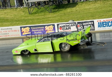 NORTHAMPTONSHIRE, UK - OCT 29: Sleek Plymouth Superbird Pro Mod funny car on the strip at the Flame and Thunder drag-racing event on Oct 29, 2011 at Santa Pod Raceway in Northamptonshire, UK