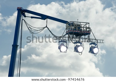 high powered spotlights illuminating an outdoor movie set