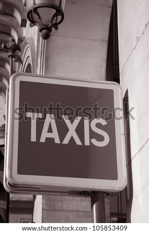 Blue Taxi Sign in Paris Street, France