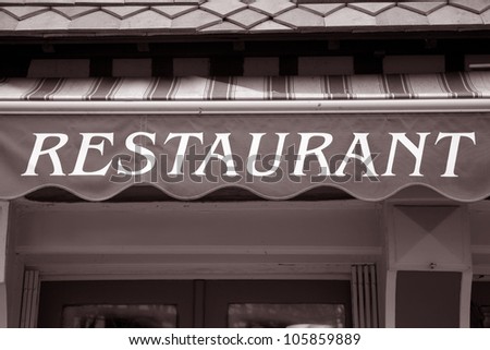 Restaurant Sign on Blind over Restaurant