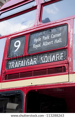 Red London Bus Directions showing Trafalgar Square; Hyde Park Corner; Royal Albert Hall