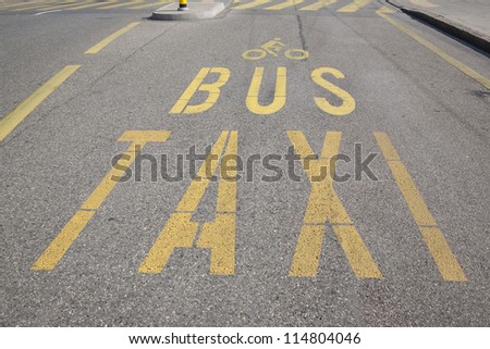 Bus, Taxi and Cycling Sign painted on Street