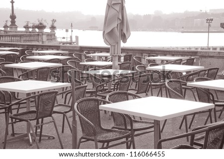Cafe Tables on Lake Geneva, Switzerland, Europe in Black and White Sepia Tone
