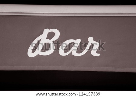 White Bar Sign on Red Material