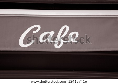Red Cafe Sign on Material