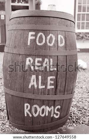 Food and Drink Menu on Barrel in Black and white Sepia Tone