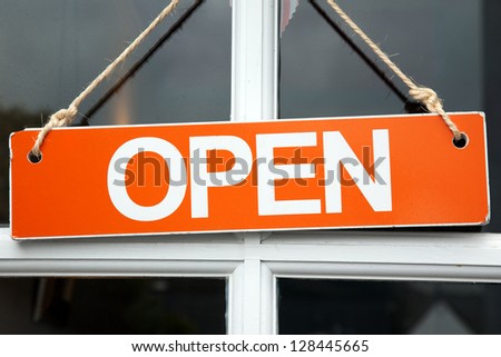 Orange Open Sign on Shop Door