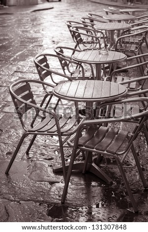 Cafe Tables and Chairs, Florence, Italy in Black and White Sepia Tone