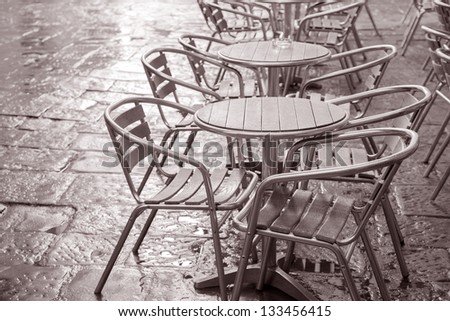Cafe Chairs and Tables in Florence, Italy in Black and White Sepia Tone