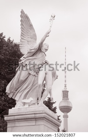 Warrior Sculpture by Schinkel (1840), Schlossbrucke Bridge, Unter den Linden Street; Berlin; Germany in Black and White Sepia Tone with Fernsehturm TV Tower in Background