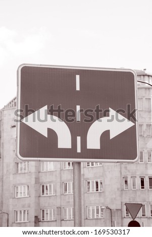 Traffic Sign with Two Arrows Pointing in Different Directions