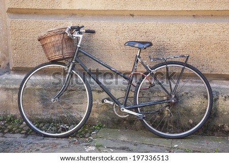 Old Black Bike in Streets of Cambridge, England, UK
