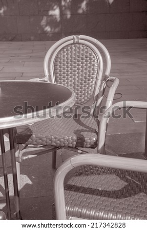 Cafe Terrace Table and Chair, Manchester, England, UK in Black and White Sepia Tone
