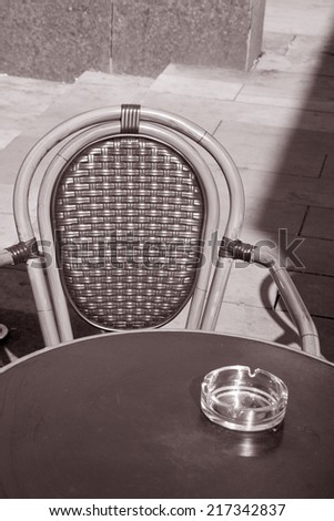 Cafe Terrace Table and Chair, Manchester, England, UK in Black and White Sepia Tone