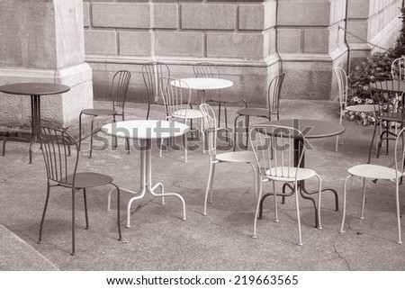 Cafe Tables and Chairs in Black and White Sepia Tone