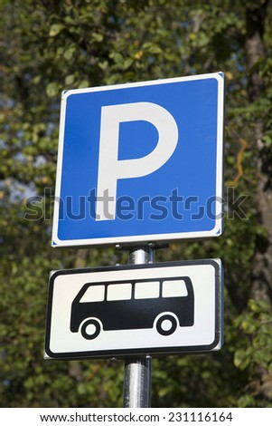 Blue Bus Parking Sign in Nature Setting