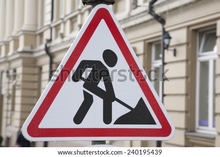 Men at Work Traffic Sign in Urban Setting
