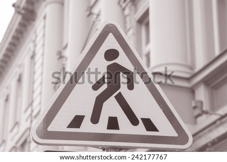 Pedestrian Sign in Urban Setting in Black and White Sepia Tone