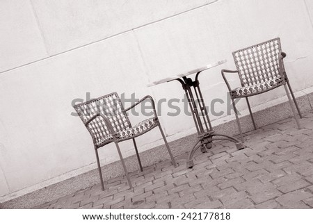 Cafe Table and Chair on Diagonal Angle in Black and White Sepia Tone