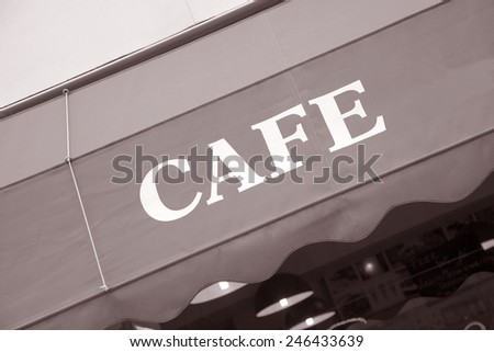 Cafe Sign on Diagonal Tilt in Black and White Sepia Tone
