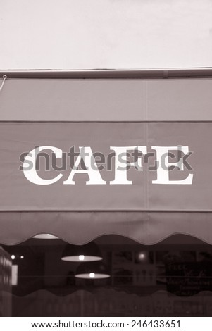 Cafe Sign on Background in Black and White Sepia Tone